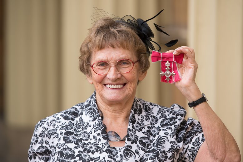 Enid Bakewell receiving her OBE